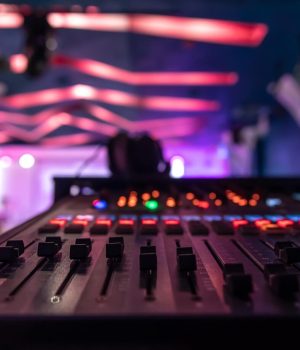 close-up-sound-music-mixer-control-panel-blurred-background_169016-16964