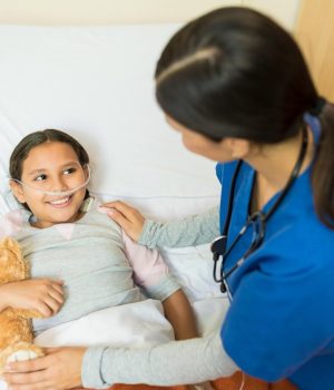 little-girl-patient-holding-teddybear-while-listening-healthcare-worker-hospital-bed-treatment_662251-3045