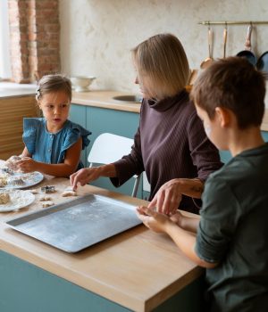 medium-shot-woman-helping-kids-cook_23-2149870136