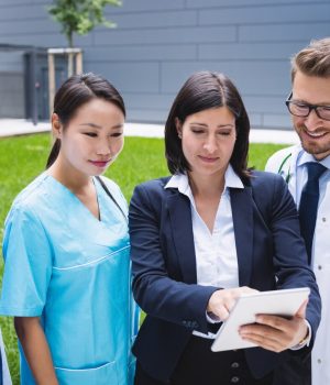 team-doctors-discussing-digital-tablet_107420-84760