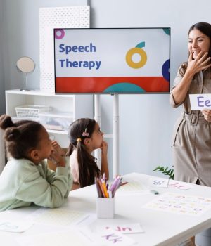 young-woman-doing-speech-therapy-with-kids_23-2149110274