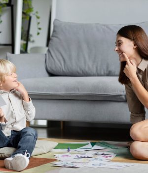 young-woman-doing-speech-therapy-with-little-boy_23-2149110211